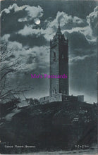 Load image into Gallery viewer, Vintage black and white postcard of a clock tower under a moonlit sky with &#39;Mrs. Postcards&#39; watermark.
