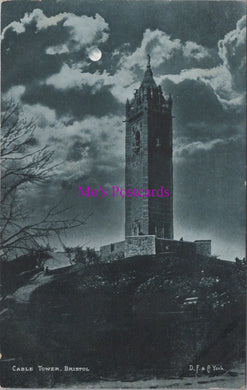 Vintage black and white postcard of a clock tower under a moonlit sky with 'Mrs. Postcards' watermark.