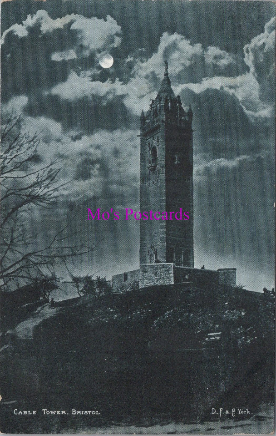 Vintage black and white postcard of a clock tower under a moonlit sky with 'Mrs. Postcards' watermark.