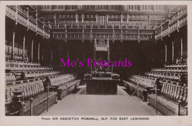 Vintage black and white photo of a large room with rows of chairs and a podium, labeled 'Mo's Postcards'.