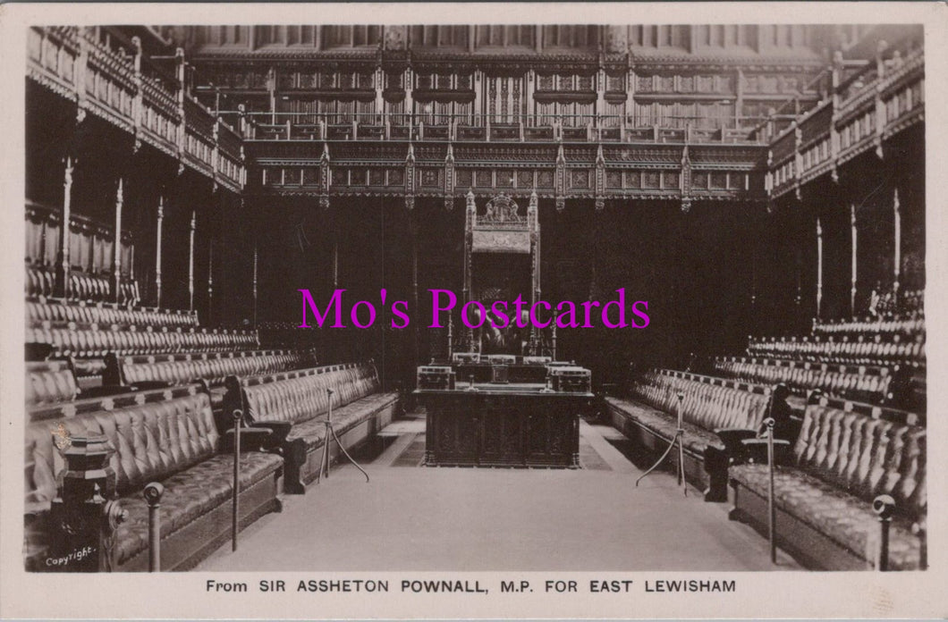 Vintage black and white photo of a large room with rows of chairs and a podium, labeled 'Mo's Postcards'.