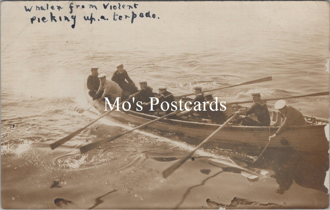 Vintage postcard of a group in a rowboat on water with text 'Whaler from Violent picking up a torpedo.'