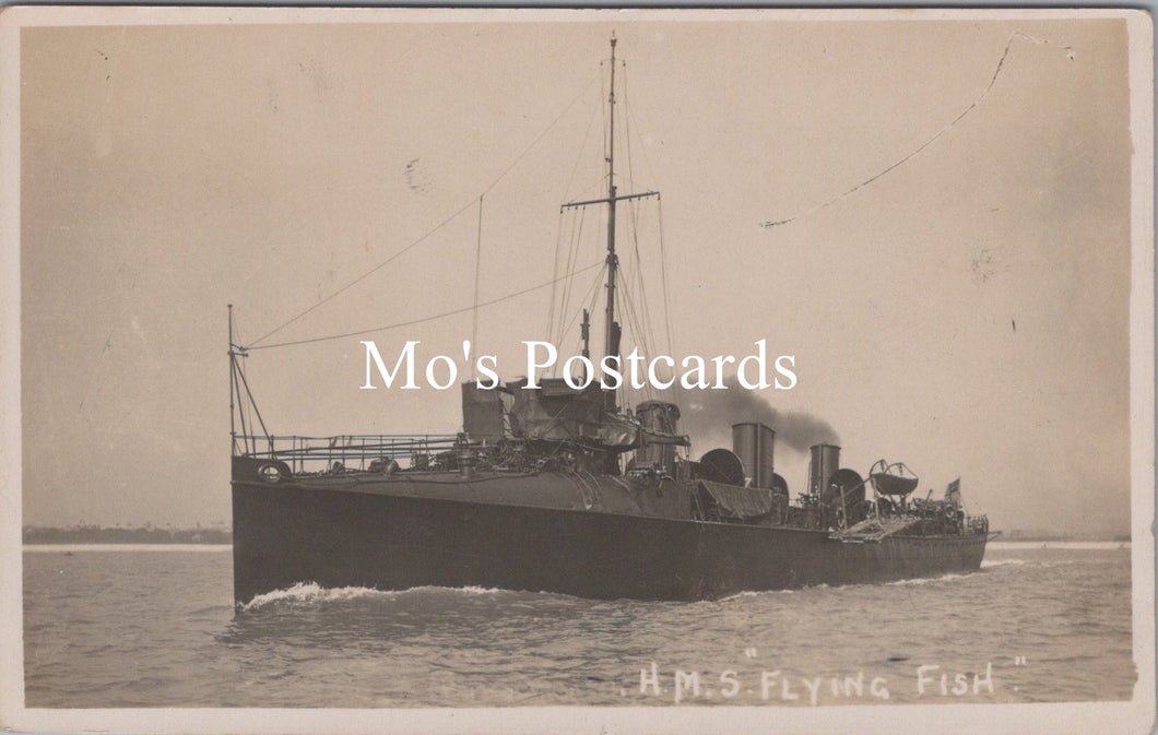 Vintage black and white photograph of a ship labeled 'H.M.S. Flying Fish' on a postcard.