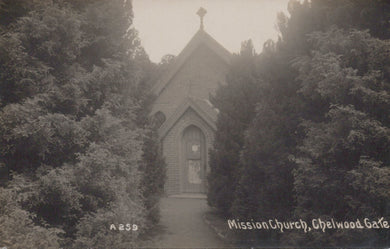 Vintage photograph of a church surrounded by trees with 'Mission Church, Chelwood Gate' text.