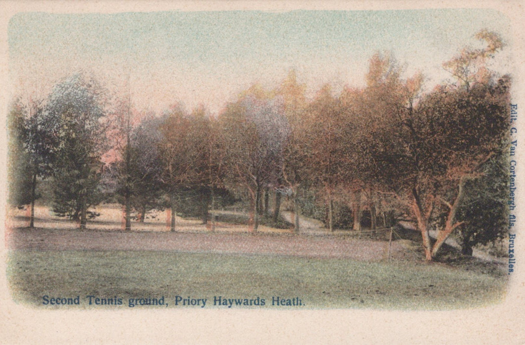 Vintage postcard of a park with trees and grass, labeled 'Second Tennis ground, Priory Haywards Heath'.