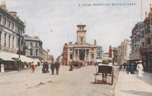 Load image into Gallery viewer, Vintage postcard of South Street in Worthing with a clock tower and people on the street.

