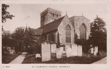 Vintage photograph of St Clement's Church in Sandwich, featuring a stone building with a clock tower and gravestones.