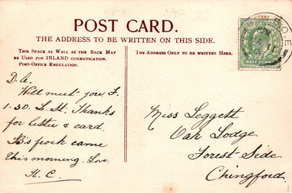 Vintage postcard with handwritten text and a stamp, featuring airmail label.