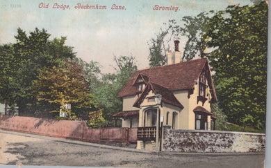 Vintage postcard of a house with trees and a road in the background
