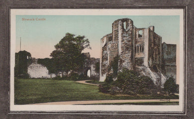 Vintage postcard of Newark Castle ruins with green grass and trees.