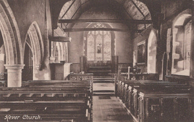 Interior of a church with pews and stained glass window