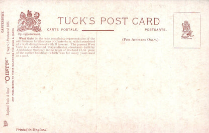 Vintage Tuck's postcard with text and stamps on a light brown background