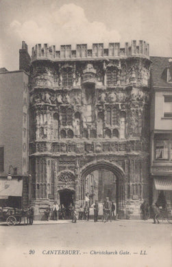 Vintage photograph of Christchurch Gate in Canterbury, featuring a large stone gatehouse with people gathered around.