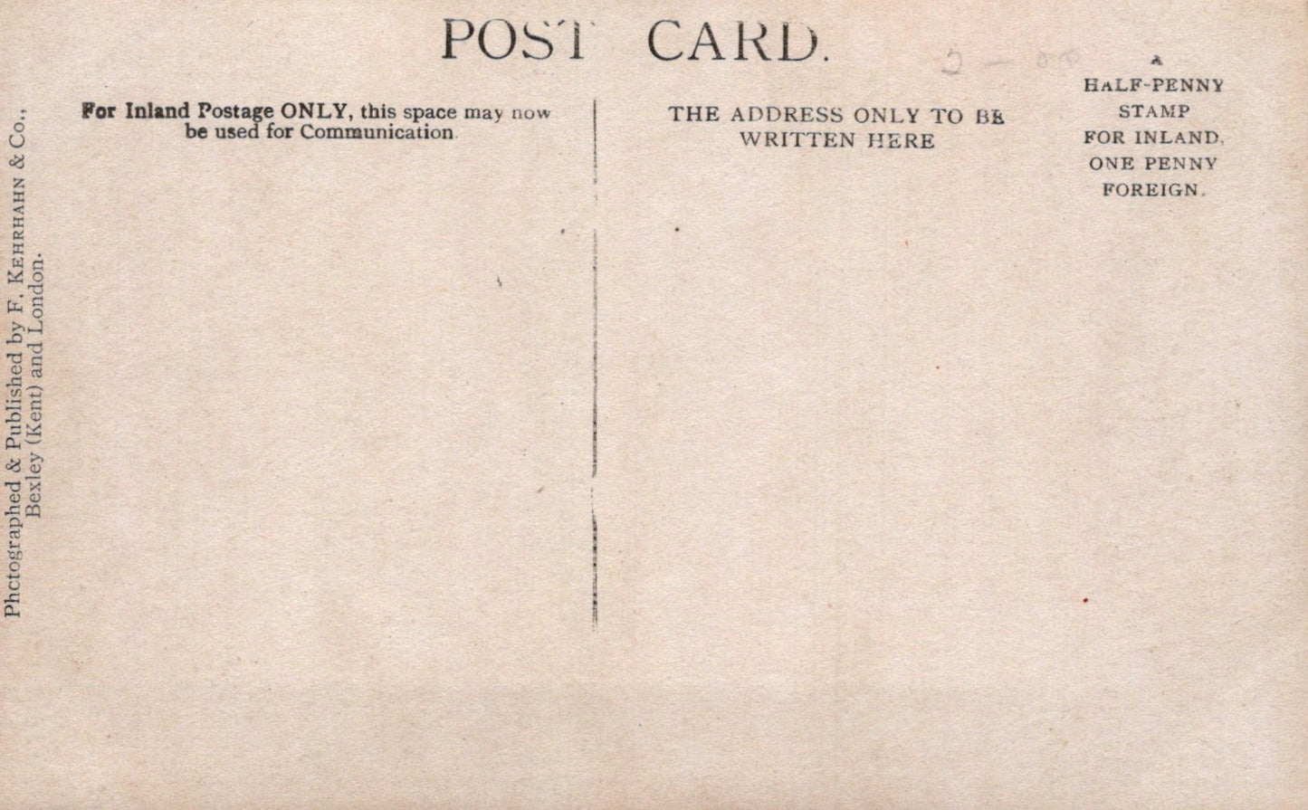 Back of a vintage postcard with printed text and a plain center