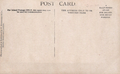 Back of a vintage postcard with printed text and a plain center