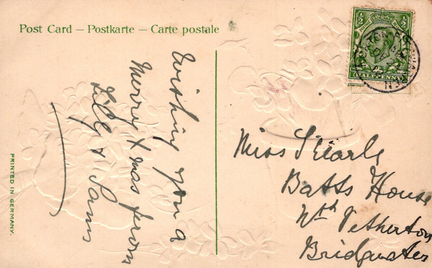 Vintage postcard with handwritten text and a stamp on a textured background