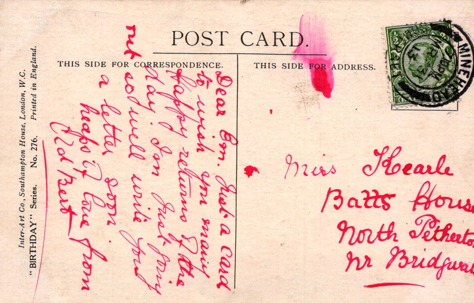 Vintage postcard with handwritten text and a stamp, featuring a red ink stamp on the right side.
