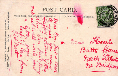 Vintage postcard with handwritten text and a stamp, featuring a red ink stamp on the right side.