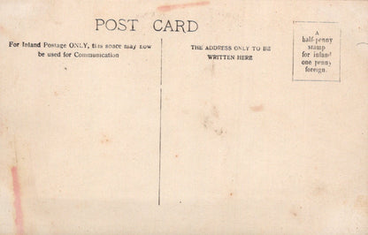 Vintage postcard with text and stamps on a beige background