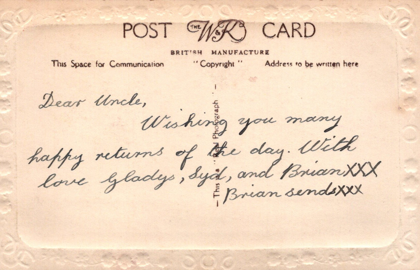 Vintage postcard with handwritten message on a beige background