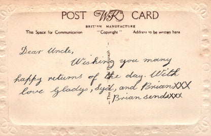 Vintage postcard with handwritten message on a beige background