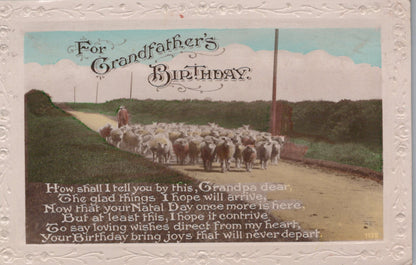 Vintage birthday card with a shepherd and sheep on a road, text overlay.