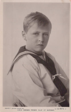 Vintage photograph of a young boy in a formal outfit with a sailor-style shirt and tie.