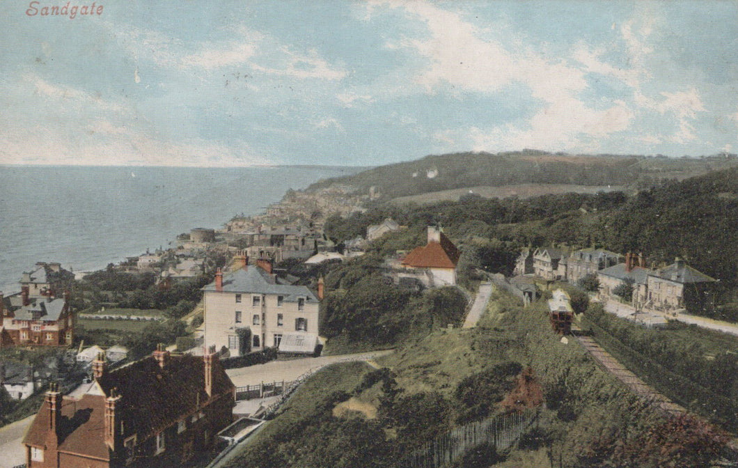 Village by the sea with houses and a coastal landscape.