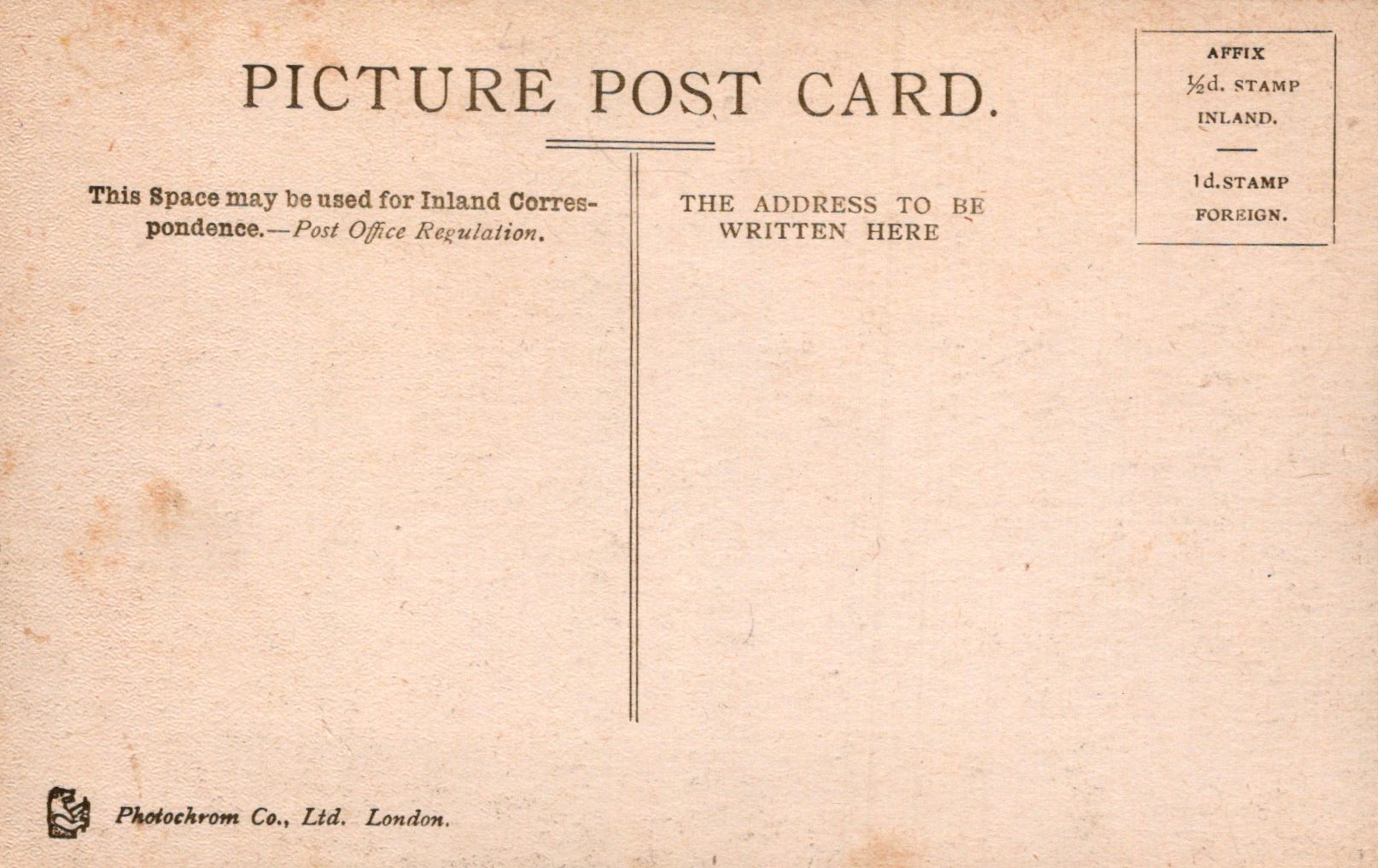 Vintage picture postcard with text and stamps on a beige background