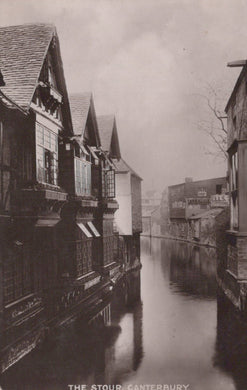 Vintage black and white photograph of a canal with buildings on either side in Canterbury.