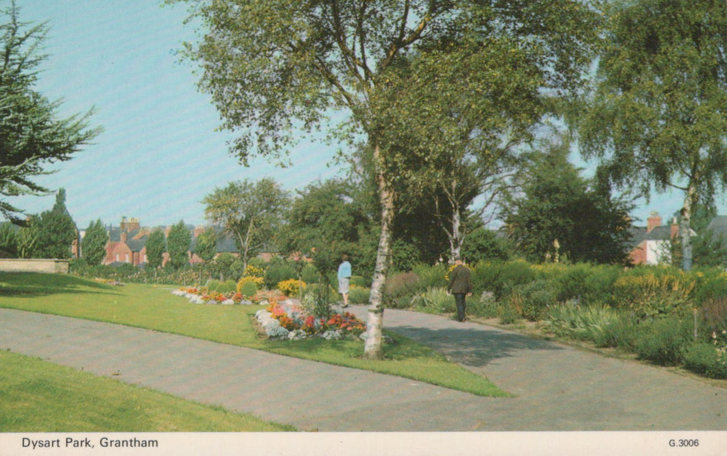 Scenic view of a park with trees, flowers, and a path in Dyrart Park, Grantham.