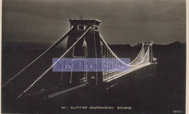 Black and white image of Clifton Suspension Bridge at night with visible text overlay.