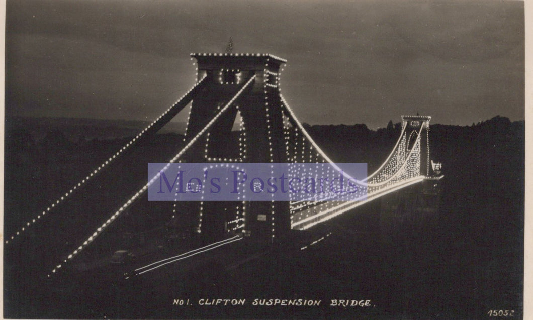Black and white image of Clifton Suspension Bridge at night with visible text overlay.