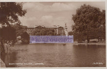 Load image into Gallery viewer, Sepia-toned photograph of Buckingham Palace with a lake in the foreground
