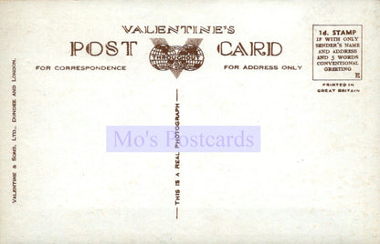 Vintage Valentine's postcard with text and a heart design on a beige background.