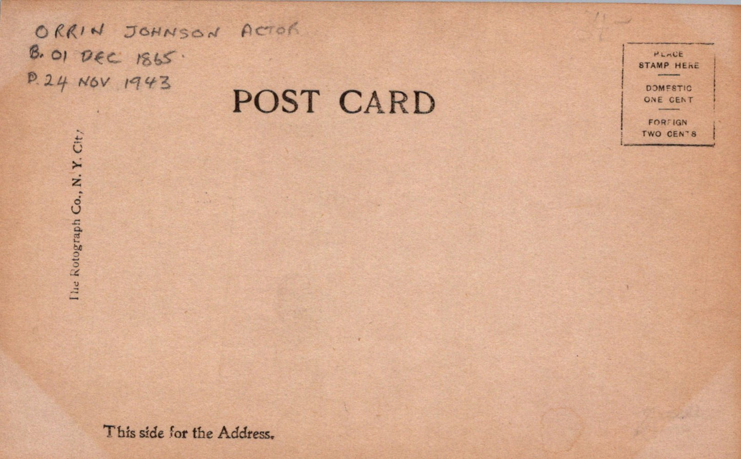 Back of a vintage postcard with text and a stamp