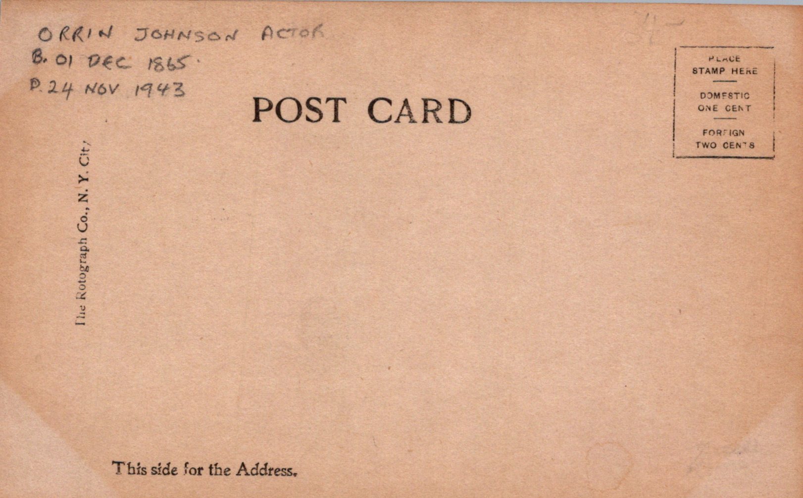 Back of a vintage postcard with text and a stamp