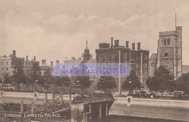 Vintage black and white photograph of Lambeth Palace in London with a bridge and trees in the foreground.