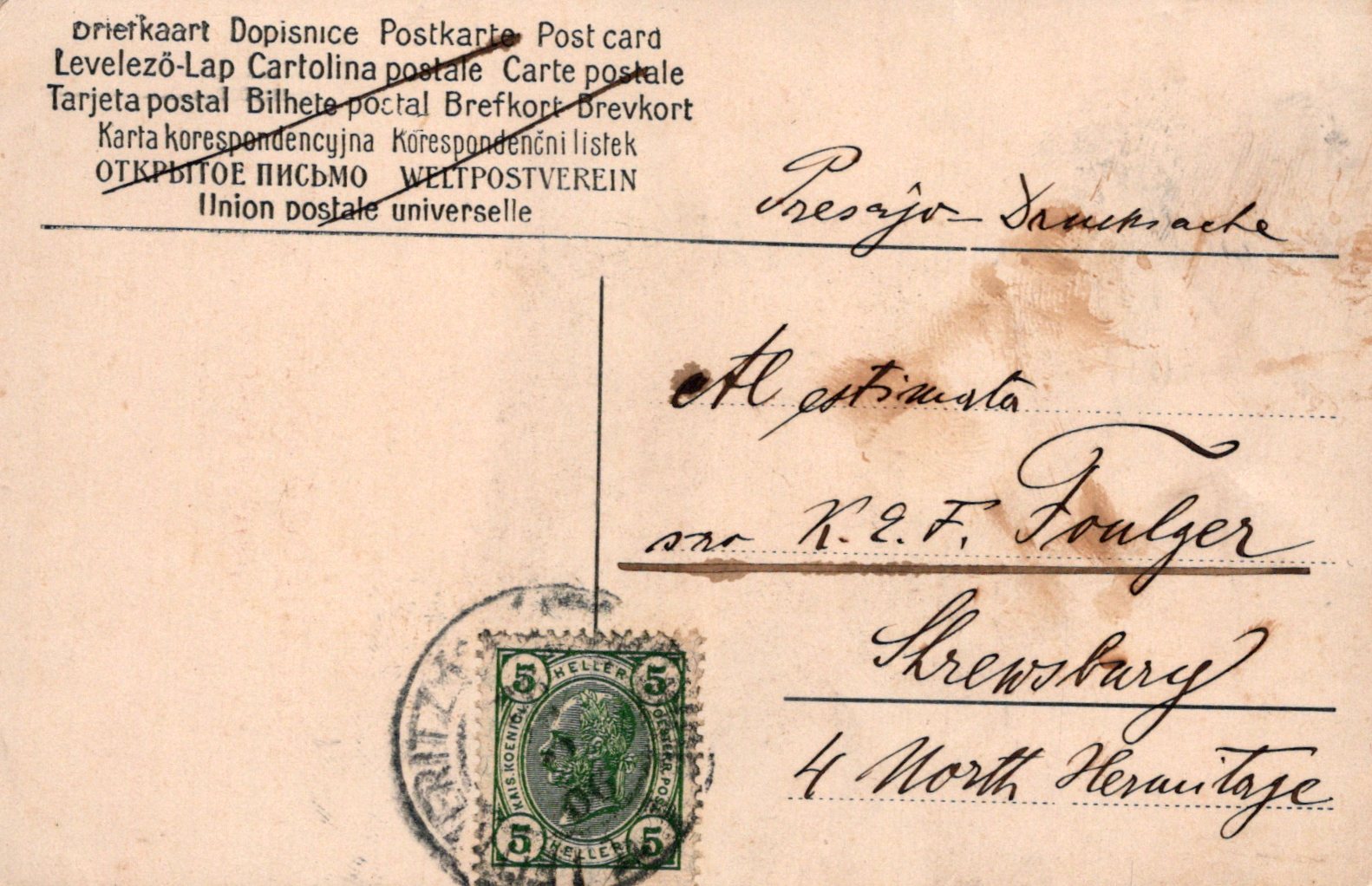 Vintage postcard with postage stamp and handwritten text on a beige background
