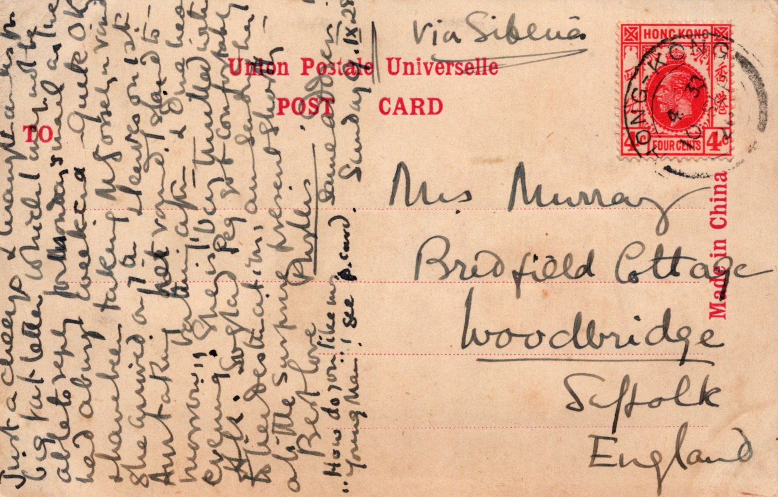 Vintage postcard with handwritten text and a red stamp, addressed to Miss Murray at Bradfield Cottage, Woodbridge, Suffolk, England.