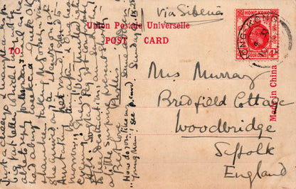 Vintage postcard with handwritten text and a red stamp, addressed to Miss Murray at Bradfield Cottage, Woodbridge, Suffolk, England.