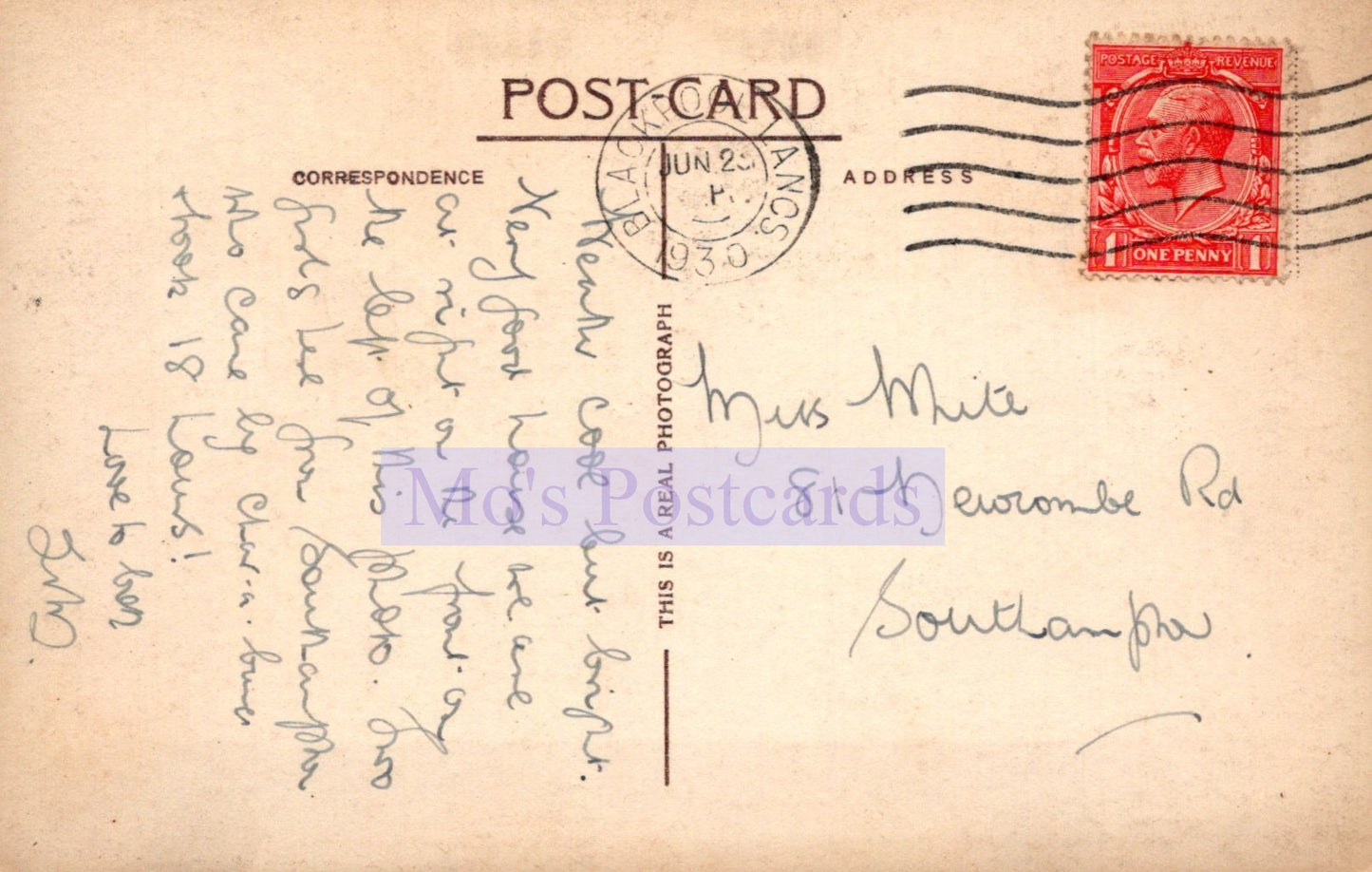 Vintage postcard with handwritten text and a red stamp on a beige background