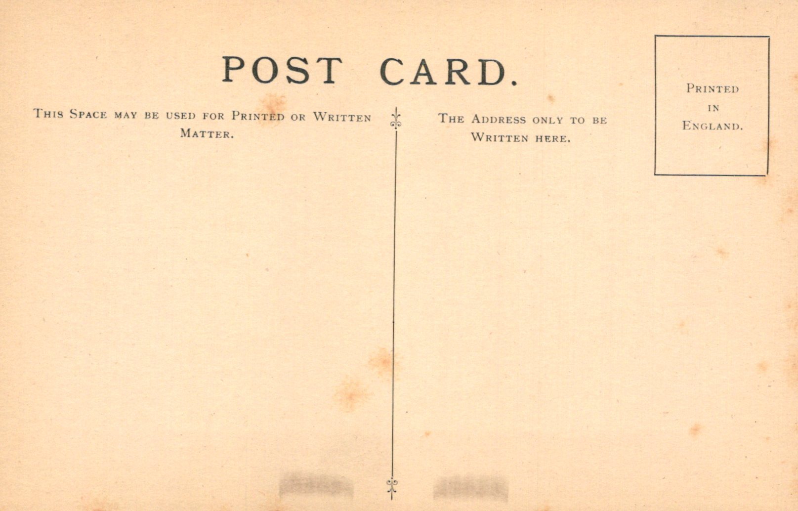 Vintage postcard with text and a line dividing the front and back