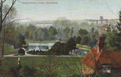 Vintage postcard of Alexandra Park, Hastings with a person looking towards the park.