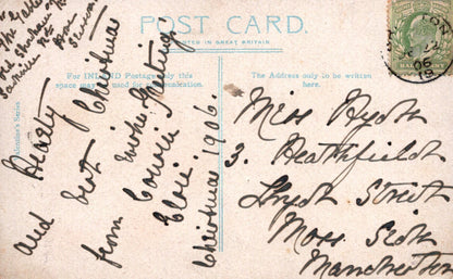Vintage postcard with handwritten text and a stamp, featuring the word 'Postcard'.
