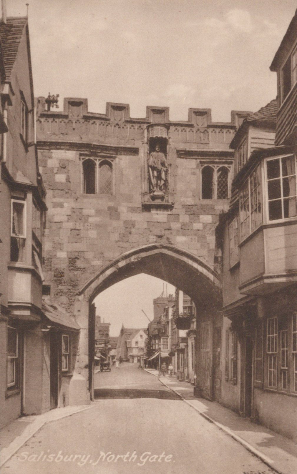 Vintage photograph of Salisbury North Gate with stone archway and surrounding buildings.