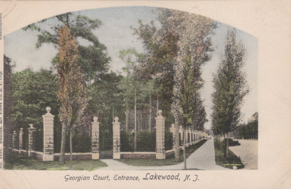 Vintage postcard of a garden entrance with trees and a path, labeled 'Georgian Court, Entrance, Lakewood, N.J.'