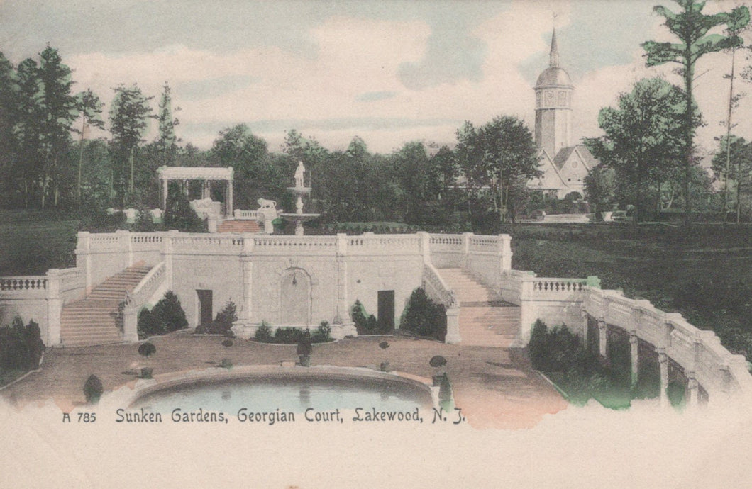 Vintage postcard of Sunken Gardens at Georgian Court in Lakewood, NJ with a church in the background.