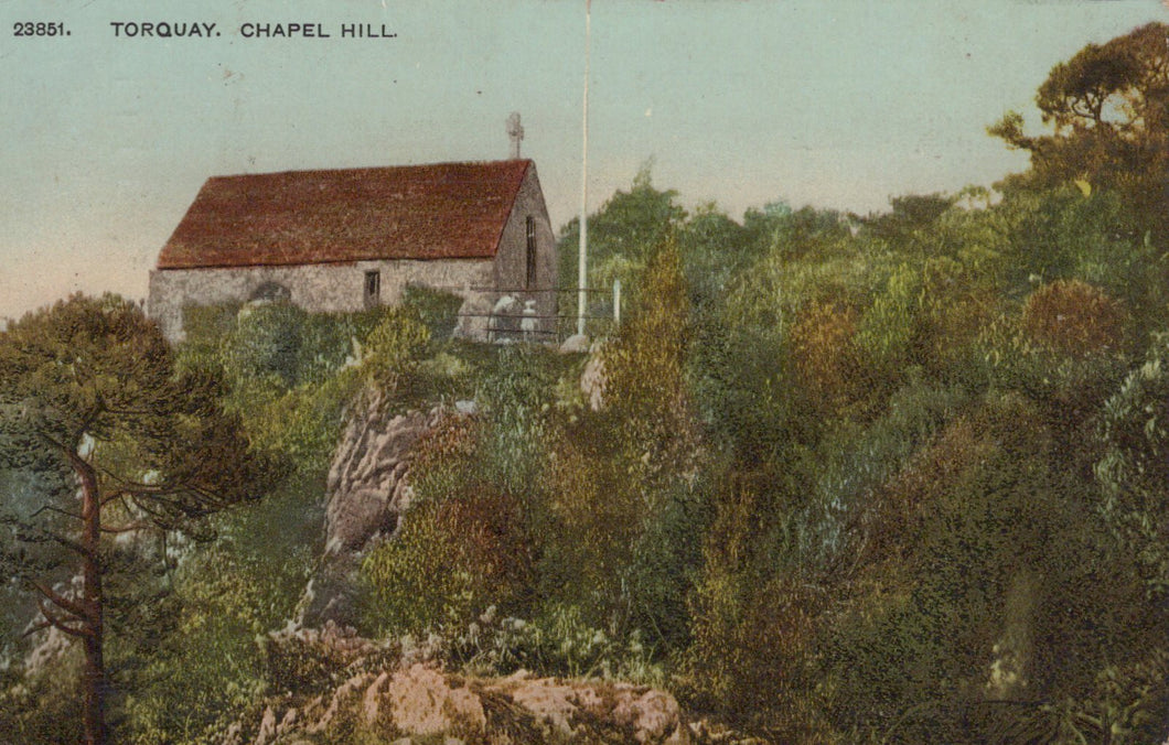 Vintage postcard of a small building on Chapel Hill in Torquay, surrounded by trees and greenery.