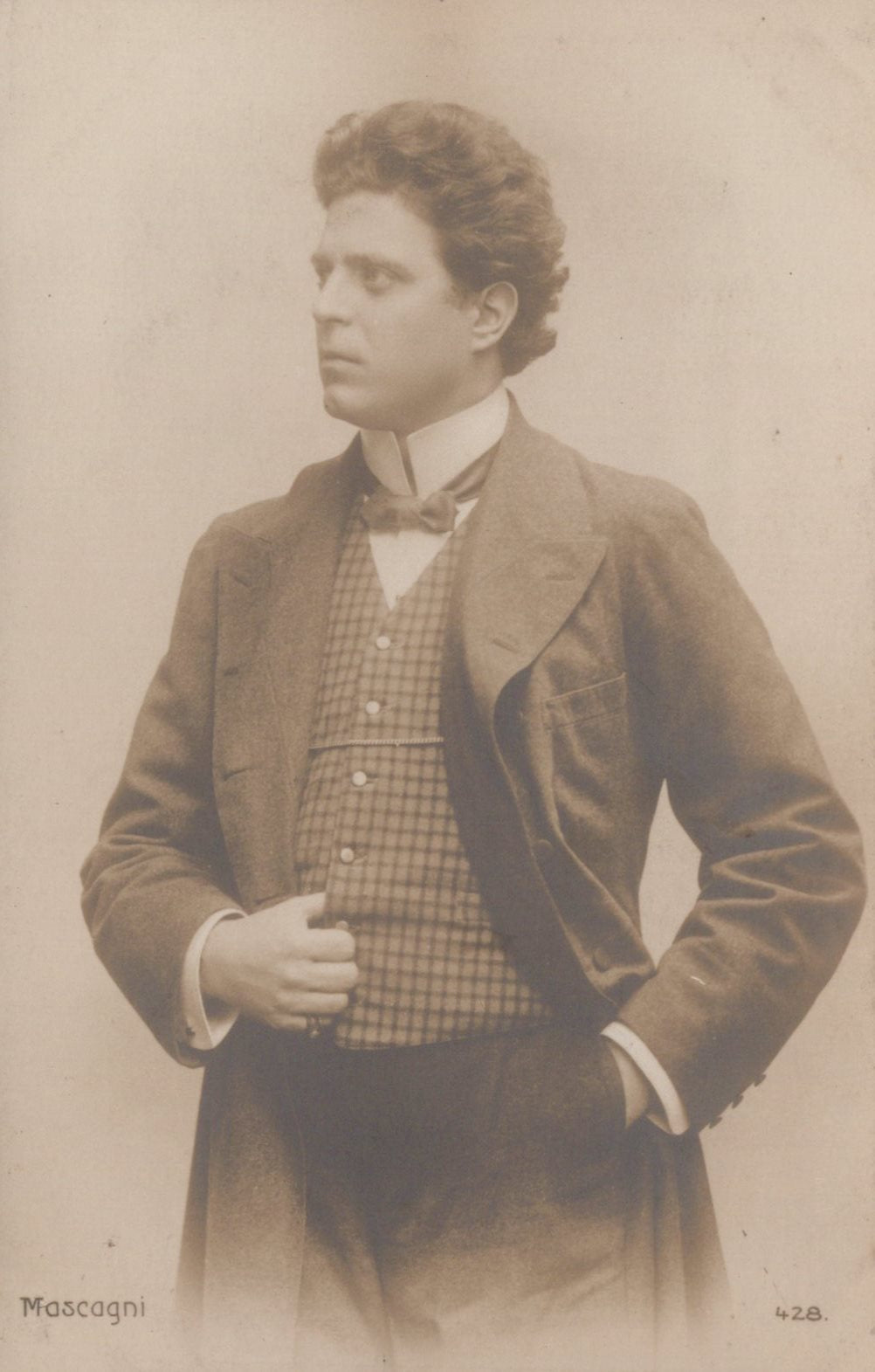 Vintage photograph of a man in formal attire with a bow tie